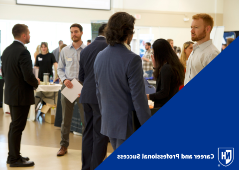 Student and employer interacting at Accounting Career Fair with CaPS logo in bottom left corner